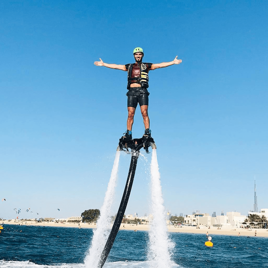 A man flyboarding above the water, a thrilling water sport in Dubai that lifts you into the air.