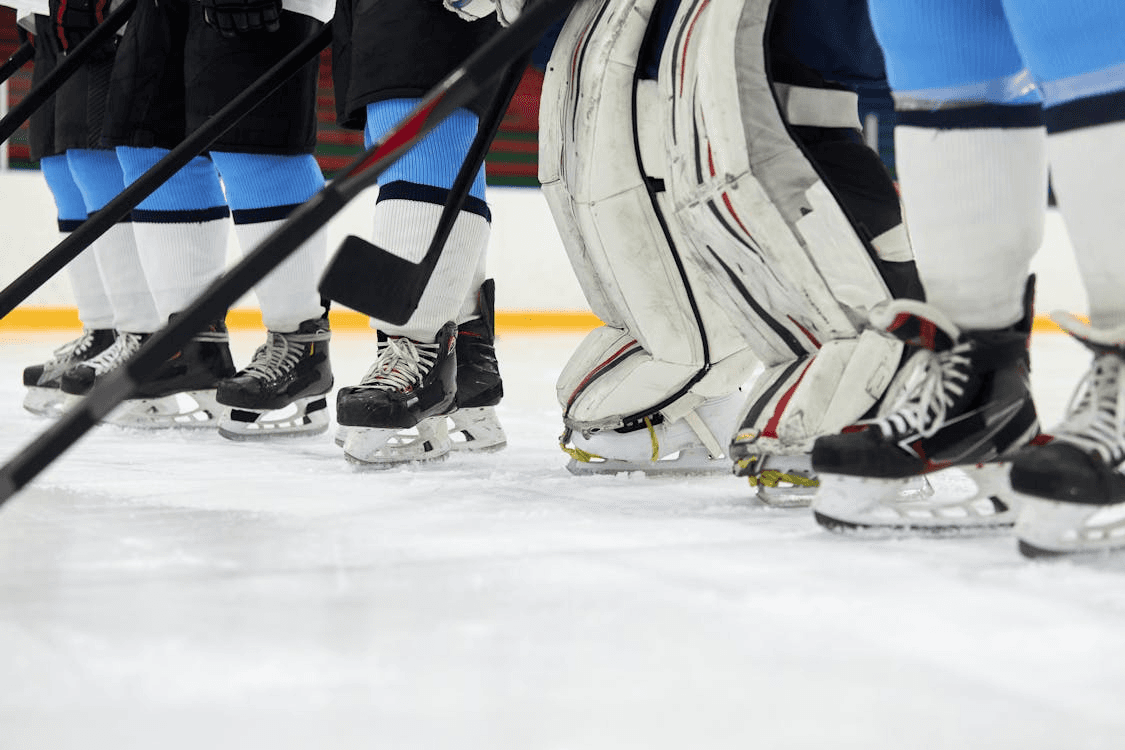 Group of ice hockey players standing on an indoor ice rink in Dubai.