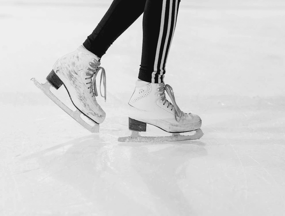 Close-up of ice skates on an indoor rink in Dubai, showing a unique way to celebrate a birthday with ice skating.
