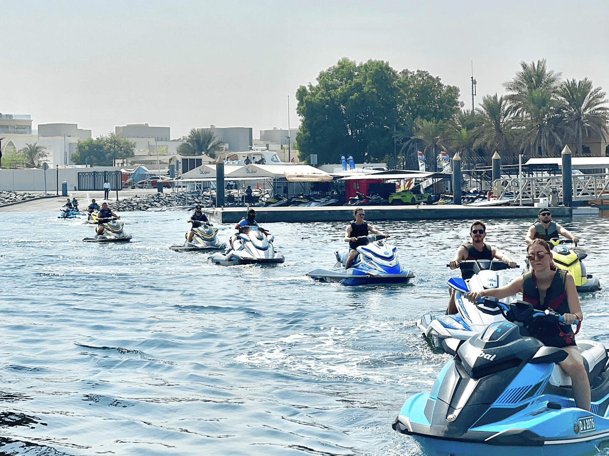 Group of jet ski riders starting their tour from the calm waters at Jumeirah Beach