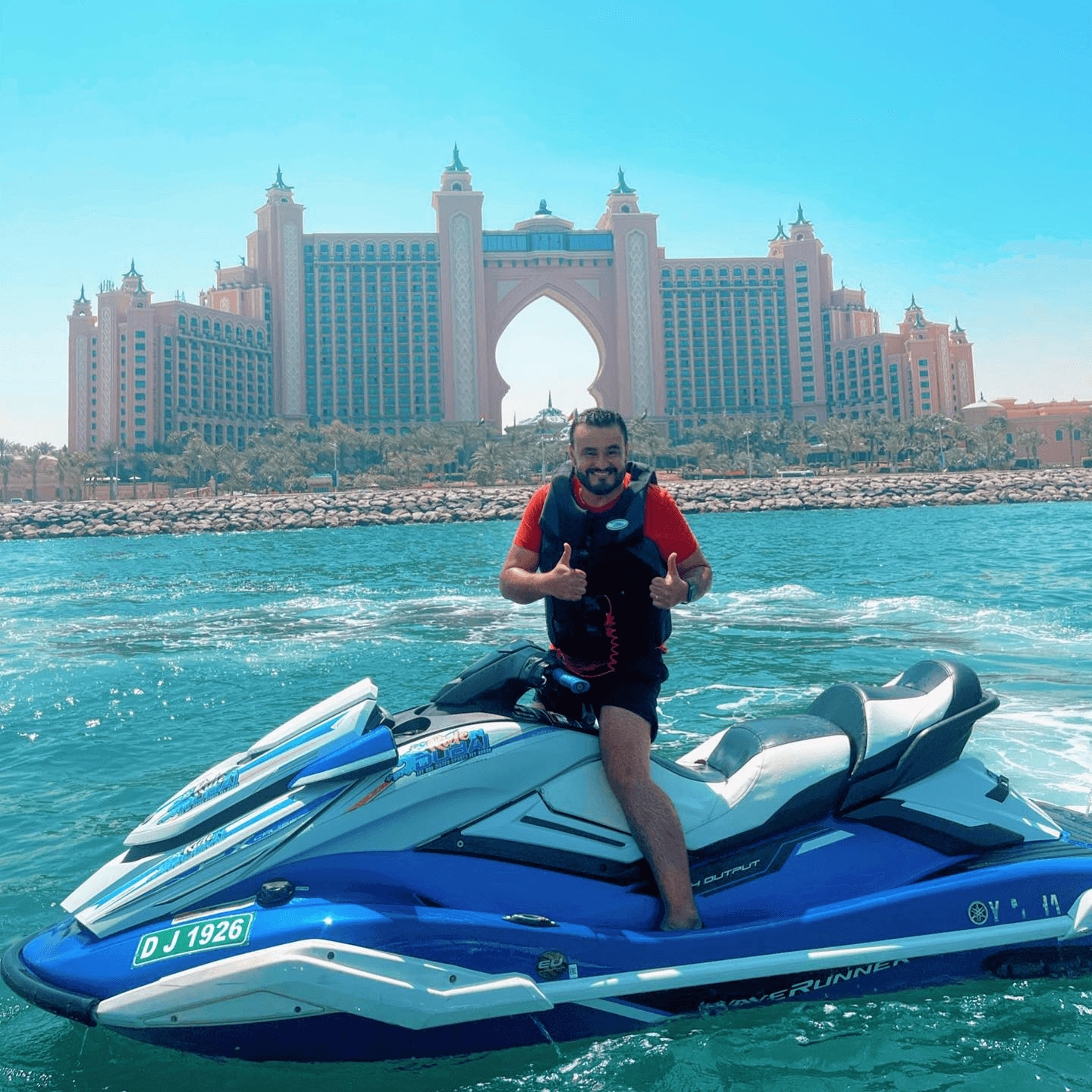 Man riding a jet ski taking photo at Dubai’s iconic man-made island, Palm Jumeirah