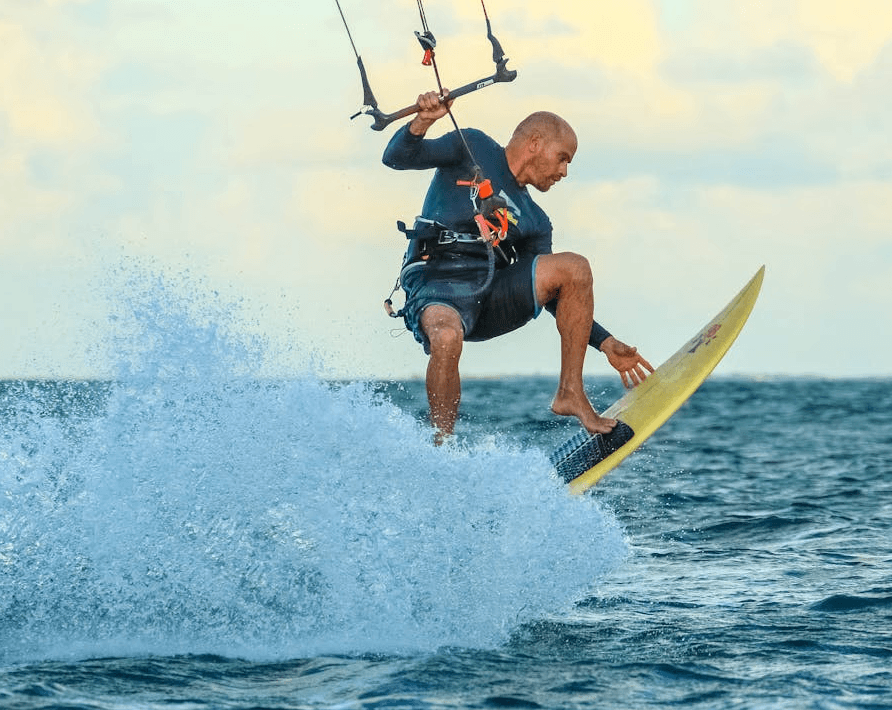 Man wakeboarding and performing a jump on ocean waves in Dubai