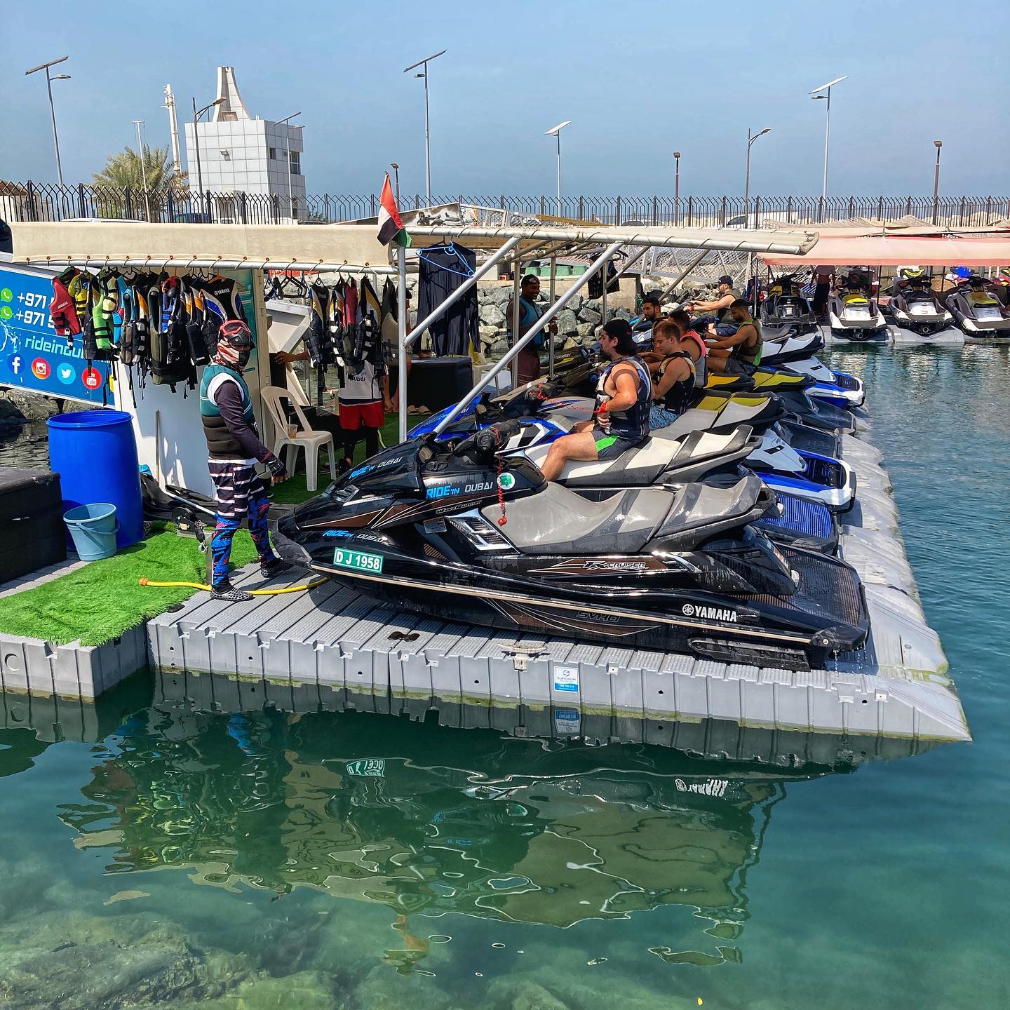Jet ski riders preparing for fun beach water sports at Ride in Dubai Marina. Follow the packing checklist for safe and enjoyable water sports in Dubai and jet ski water sports adventures.