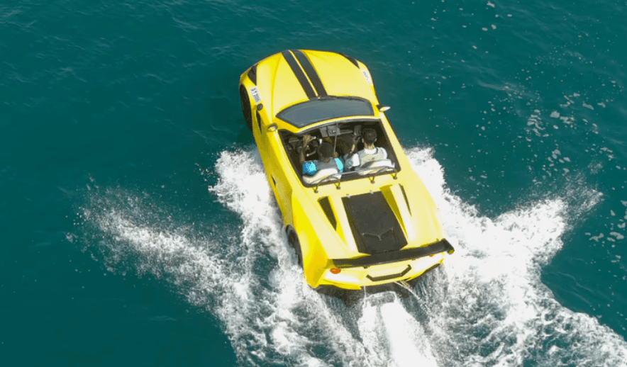 A yellow Jet Car cruising on the water in Dubai, a unique and exciting family ride experience.
