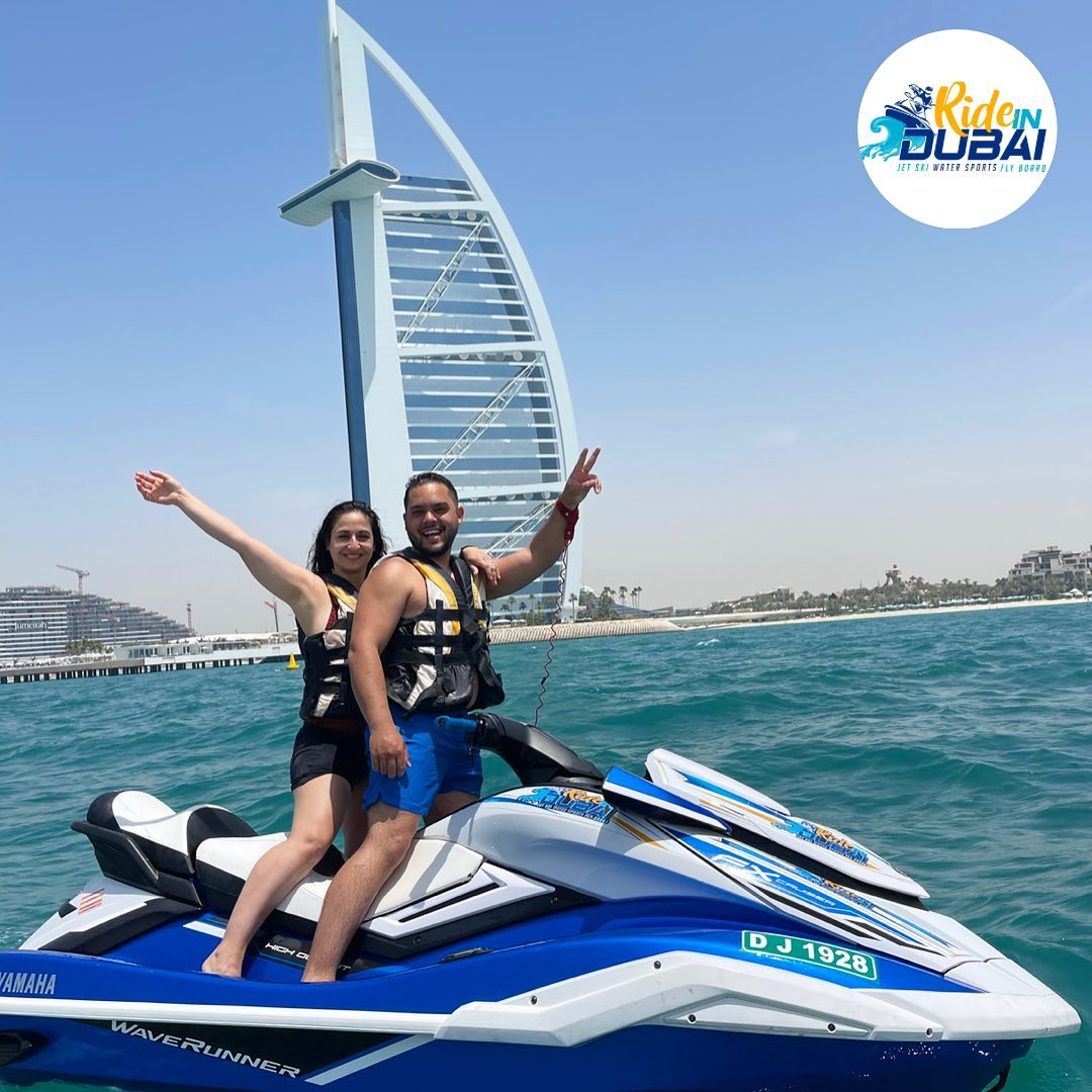 Couple jet skiing near Burj Al Arab during guided Ride in Dubai tour