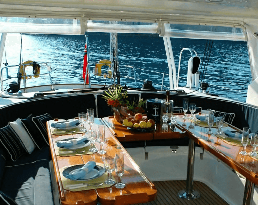 Dining area setup on a luxury yacht in Dubai prepared for guests booking watersports packages