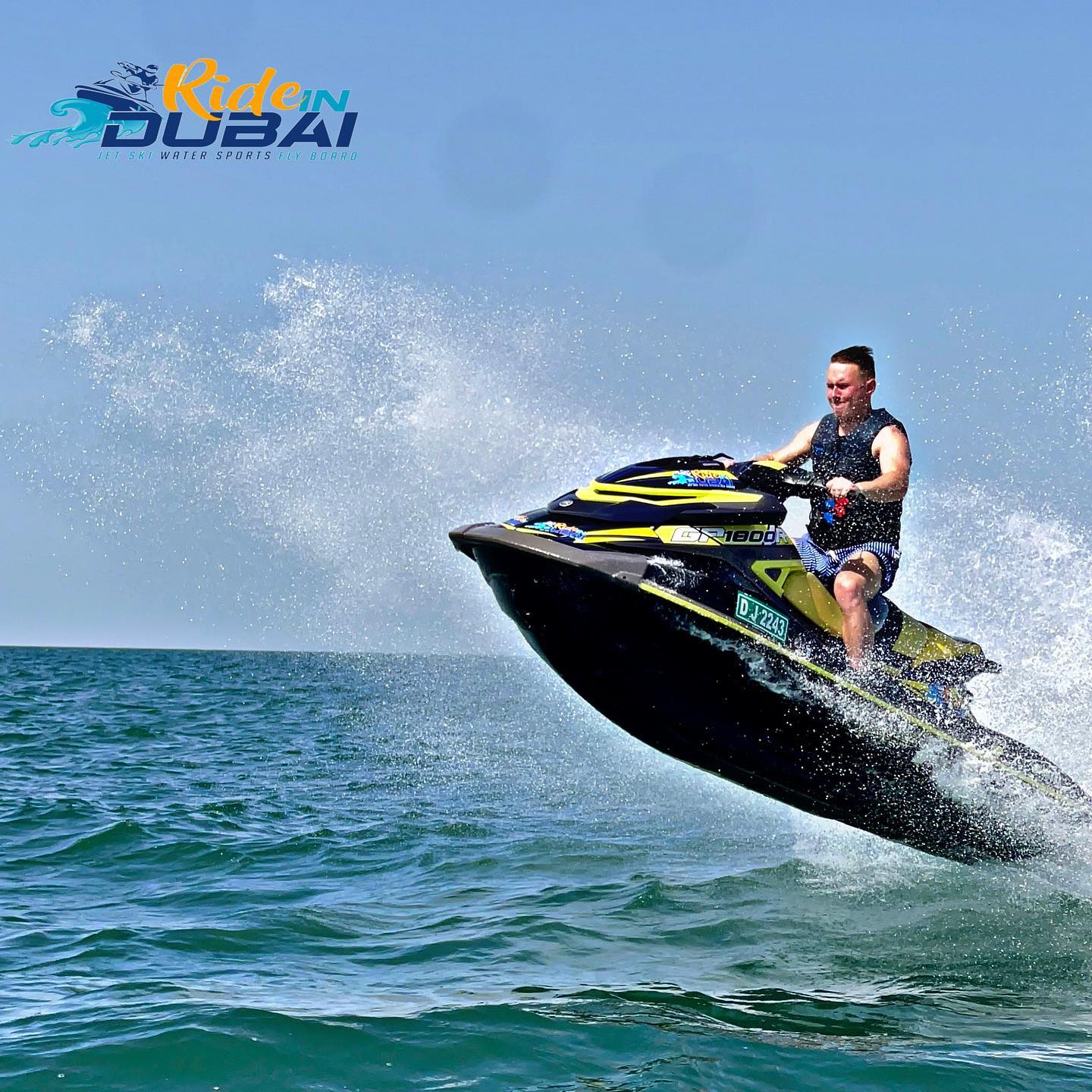 Jet ski rental Dubai rider jumps over waves. Learn how much jet ski rental cost and explore best tours along the coastline.